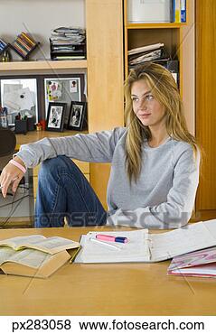 Stock Photo - teenage girl with 
homework. fotosearch 
- search stock 
photos, pictures, 
images, and photo 
clipart