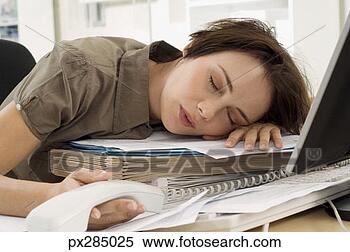 Stock Image - businesswoman 
sleeping at desk. 
fotosearch - search 
stock photos, 
pictures, images, 
and photo clipart