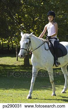 Arquivo de Fotografia - menina,  montando, 
 cavalo. fotosearch 
- busca de fotos, 
imagens e clipart