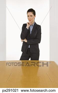 Stock Photography - businesswoman 
by table. fotosearch 
- search stock 
photos, pictures, 
images, and photo 
clipart