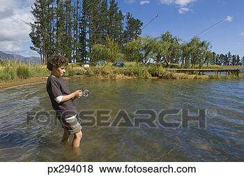 Banco de Imagem - menino,  pesca, 
 lago. fotosearch 
- busca de fotos, 
imagens e clipart