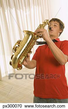 Stock Photography - boy playing saxophone. 
fotosearch - search 
stock photos, 
pictures, images, 
and photo clipart