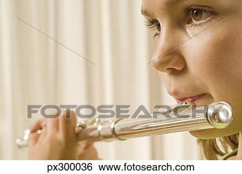Stock Photo - girl playing flute. 
fotosearch - search 
stock photos, 
pictures, images, 
and photo clipart