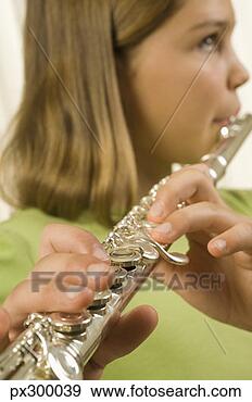 Stock Photograph - girl playing flute. 
fotosearch - search 
stock photos, 
pictures, images, 
and photo clipart
