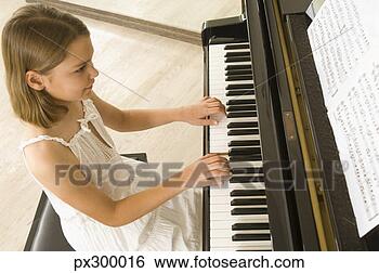 Stock Photo - girl playing piano. 
fotosearch - search 
stock photos, 
pictures, images, 
and photo clipart