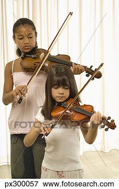 Picture - girls playing 
duet of violins. 
fotosearch - search 
stock photos, 
pictures, images, 
and photo clipart