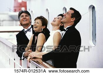 Stock Photo - mature couple 
and a mid adult 
couple standing 
on the deck of 
a cruise. fotosearch 
- search stock 
photos, pictures, 
images, and photo 
clipart