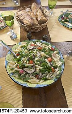 Stock Photograph - close-up of pasta 
and loaves of 
bread on a dining 
table. fotosearch 
- search stock 
photos, pictures, 
images, and photo 
clipart