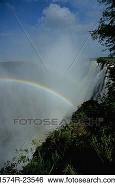 Stock Photo - low angle view 
of a rainbow over 
a waterfall,  
victoria falls. 
fotosearch - search 
stock photos, 
pictures, images, 
and photo clipart