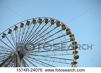 Stock Photo - low angle view 
of a ferris wheel 
spinning, bangkok, 
thailand. fotosearch 
- search stock 
photos, pictures, 
images, and photo 
clipart