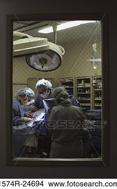 Stock Photo - surgeons operating 
in an operating 
room. fotosearch 
- search stock 
photos, pictures, 
images, and photo 
clipart