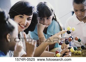 Stock Image - female teacher 
showing her students 
a model of a molecular 
structure. fotosearch 
- search stock 
photos, pictures, 
images, and photo 
clipart