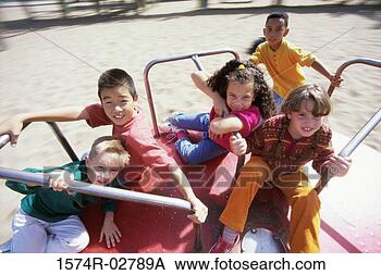 Stock Photo - portrait of a 
group of children 
sitting on a merry-go-round. 
fotosearch - search 
stock photos, 
pictures, images, 
and photo clipart