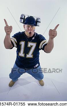 Stock Image - portrait of a 
sports fan holding 
his fingers up. 
fotosearch - search 
stock photos, 
pictures, images, 
and photo clipart
