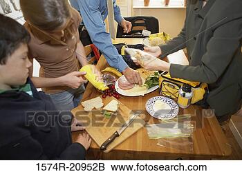Stock Photo - mid section view 
of a mid adult 
couple with their 
son and daughter 
at. fotosearch 
- search stock 
photos, pictures, 
images, and photo 
clipart