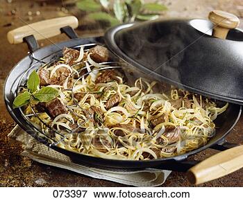 Picture - beef with onions 
and chinese noodles 
cooked in a wok. 
fotosearch - search 
stock photos, 
pictures, images, 
and photo clipart