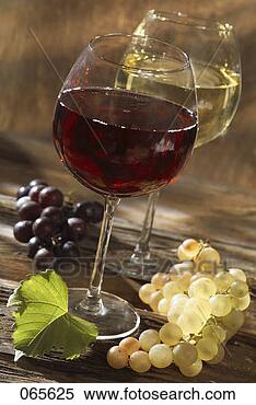 Stock Image - glasses of red 
and white wine 
with bunches of 
grapes. fotosearch 
- search stock 
photos, pictures, 
images, and photo 
clipart