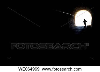 Stock Photograph - person coming 
out from an old 
tunnel. fotosearch 
- search stock 
photos, pictures, 
wall murals, images, 
and photo clipart