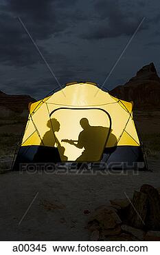 Stock Image - silhouette of 
a couple sitting 
inside a tent. 
fotosearch - search 
stock photos, 
pictures, images, 
and photo clipart