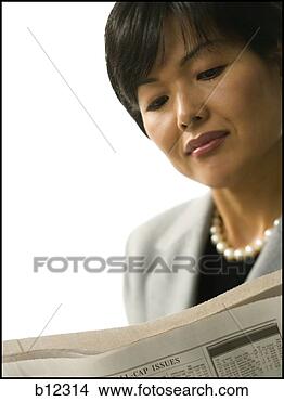 Stock Photo - asian woman reading 
a newspaper. fotosearch 
- search stock 
photos, pictures, 
images, and photo 
clipart