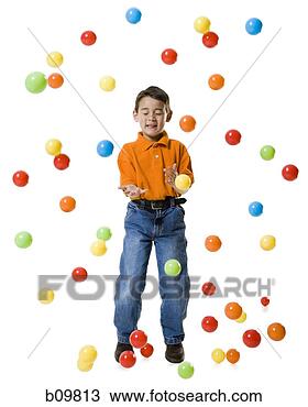 Stock Photo - boy playing with 
colored balls. 
fotosearch - search 
stock photos, 
pictures, images, 
and photo clipart