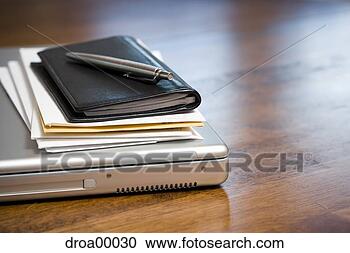 Stock Photography - close-up of laptop 
daytimer and papers 
on desk. fotosearch 
- search stock 
photos, pictures, 
images, and photo 
clipart