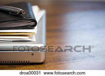 Stock Photography - close-up of laptop 
daytimer and papers 
on desk. fotosearch 
- search stock 
photos, pictures, 
images, and photo 
clipart