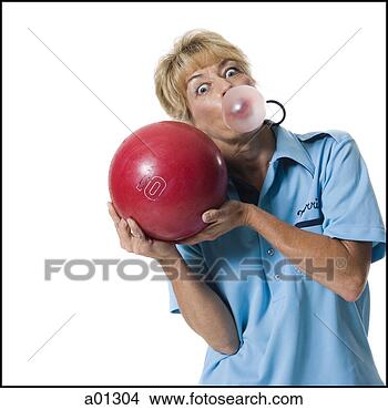 Stock Photo - a female bowler 
playfully blows 
a bubble while 
holding up a ball. 
fotosearch - search 
stock photos, 
pictures, images, 
and photo clipart