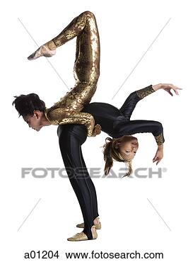 Stock Photo - female contortionist 
duo performing. 
fotosearch - search 
stock photos, 
pictures, images, 
and photo clipart