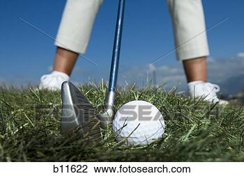 Stock Photo - female golfer 
and close-up of 
golf ball. fotosearch 
- search stock 
photos, pictures, 
images, and photo 
clipart