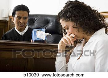 Stock Photograph - female judge offering 
tissue to a female 
witness. fotosearch 
- search stock 
photos, pictures, 
images, and photo 
clipart