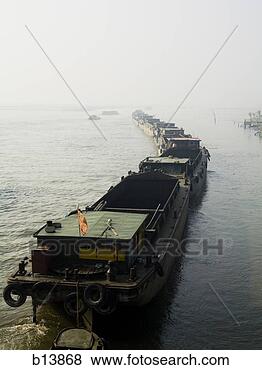 Stock Photo - line up of boats 
in water. fotosearch 
- search stock 
photos, pictures, 
images, and photo 
clipart
