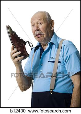 Stock Photography - male bowler sniffing 
stinky bowling 
shoes. fotosearch 
- search stock 
photos, pictures, 
images, and photo 
clipart