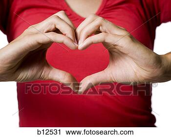 Stock Photography - woman making a 
heart shape symbol 
with her hands. 
fotosearch - search 
stock photos, 
pictures, images, 
and photo clipart