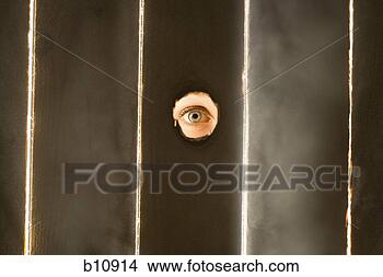 Stock Photo - woman peeping 
through hole in 
fence. fotosearch 
- search stock 
photos, pictures, 
images, and photo 
clipart