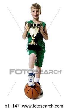 Picture - young basketball 
player holding 
trophy. fotosearch 
- search stock 
photos, pictures, 
images, and photo 
clipart