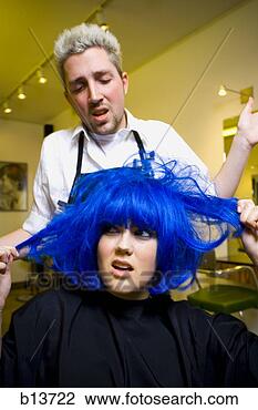 Stock Photo - young woman at 
hair salon with 
blue hair. fotosearch 
- search stock 
photos, pictures, 
images, and photo 
clipart