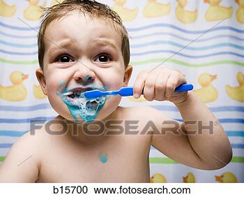 Stock Photography - boy brushing teeth 
in bathroom. fotosearch 
- search stock 
photos, pictures, 
images, and photo 
clipart