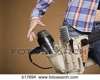 Stock Photo - mid section view 
of hairdresser 
with tool belt. 
fotosearch - search 
stock photos, 
pictures, images, 
and photo clipart
