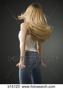 Stock Photo - woman with long 
blonde hair standing 
rear view. fotosearch 
- search stock 
photos, pictures, 
images, and photo 
clipart