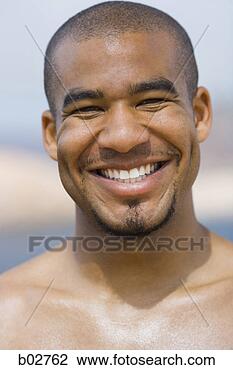 Stock Photo - close-up of a 
young man smiling. 
fotosearch - search 
stock photos, 
pictures, images, 
and photo clipart