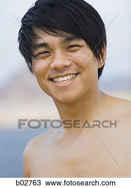 Stock Photo - close-up of a 
young man smiling. 
fotosearch - search 
stock photos, 
pictures, images, 
and photo clipart