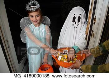 Stock Image - children out on 
halloween  the 
girl is dressed 
as a fairy princess 
in. fotosearch 
- search stock 
photos, pictures, 
images, and photo 
clipart