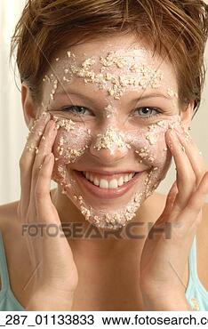 Stock Photo - front view head 
and shoulders 
young woman with 
short hair applying 
a. fotosearch 
- search stock 
photos, pictures, 
images, and photo 
clipart