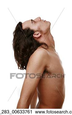 Stock Photography - half length side 
view man standing 
bare chested with 
eyebrow piercing. 
fotosearch - search 
stock photos, 
pictures, images, 
and photo clipart
