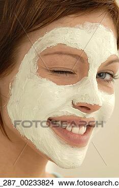 Stock Photo - headshot side 
view portrait 
young woman in 
a face mask looking 
at. fotosearch 
- search stock 
photos, pictures, 
images, and photo 
clipart