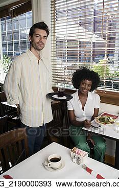 Stock Photo - a waitor brings 
a  young woman 
in her 20's wearing 
a white short. 
fotosearch - search 
stock photos, 
pictures, images, 
and photo clipart