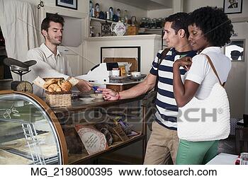 Stock Image - a young couple 
in their 20's 
or early 30's 
buy pastries at 
a bakery. fotosearch 
- search stock 
photos, pictures, 
images, and photo 
clipart