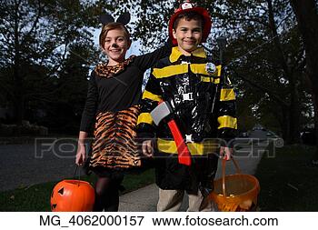 Picture - a young girl & 
boy walking down 
the sidewalk on 
a quest for more. 
fotosearch - search 
stock photos, 
pictures, images, 
and photo clipart