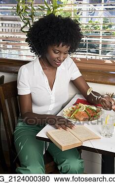 Stock Photography - a young woman 
in her 20's wearing 
a white short 
sleeve top and 
green. fotosearch 
- search stock 
photos, pictures, 
images, and photo 
clipart